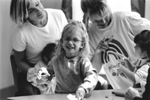 two ladies and two children in united way shirts smiling.